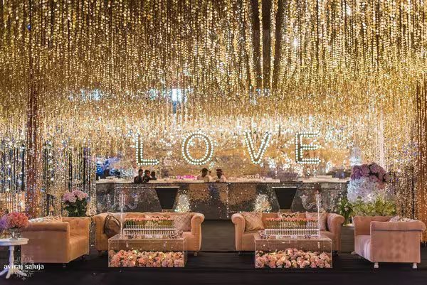 A sangeet lounge beneath golden lights